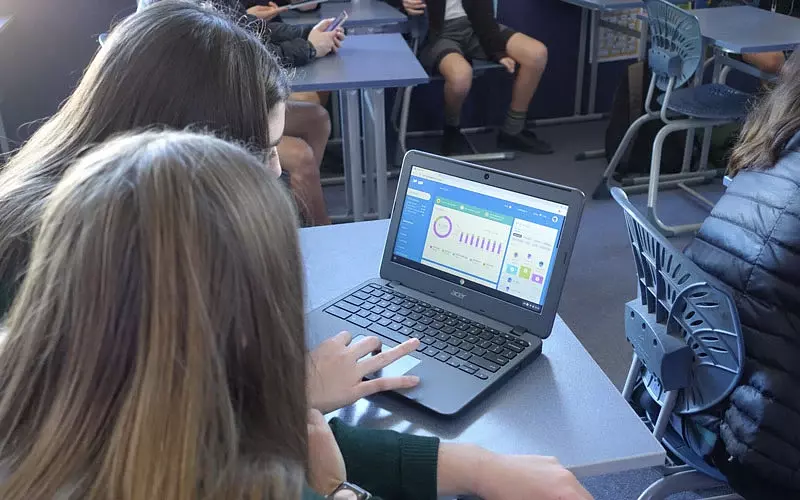 students on a laptop computer using banqer in a classroom